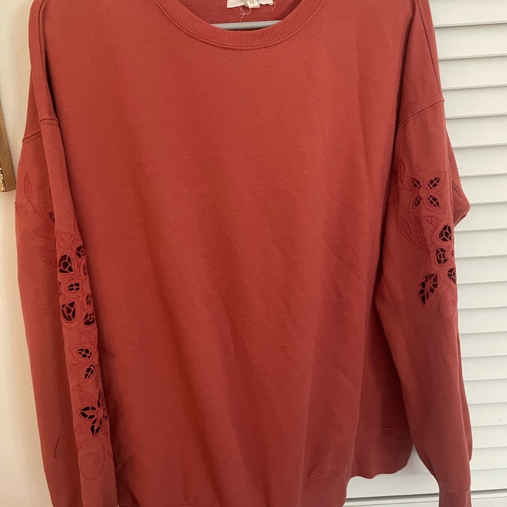 Burnt orange Sweatshirt with Floral Sleeve Design